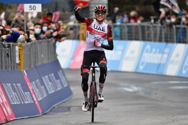 US Cyclist Joseph Lloyd Dombrowski of UCI WorldTeam UAE Team Emirates celebrates as he crosses the finish line to win the 4th stage of the 104th edition of the Giro d'Italia cycling race, a 187 km Intermediate stage from Piacenza to Sestola.