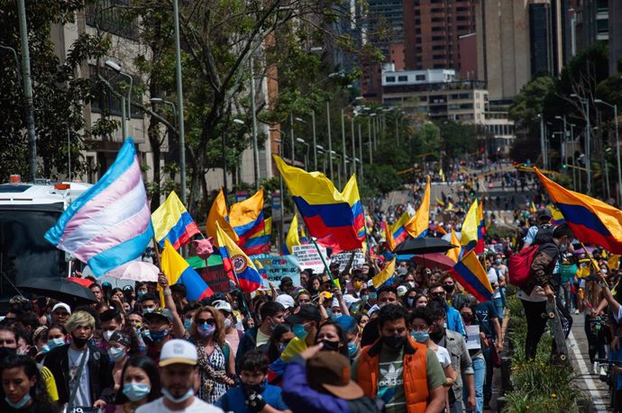 09 May 2021, Colombia, Bogota: People wave Colombian and transgender community flags during LGTB+ and Trans communities protest against Colombian President Duque's government and the police violence in dealing with the anti-government protests. Photo: C