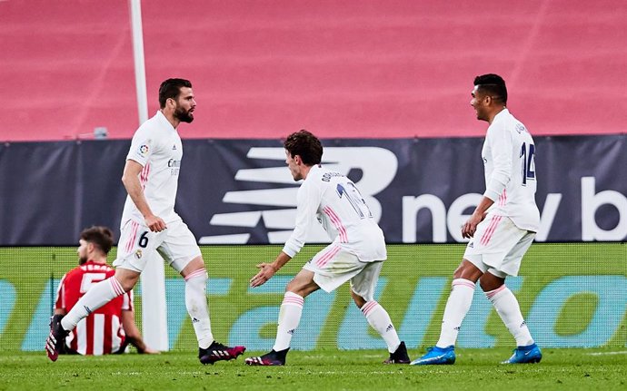 Nacho Fernandez of Real Madrid CF celebrates his goal with his teammates during the Spanish league, La Liga Santander, football match played between Athletic Club and Real Madrid CF at San Mames stadium on May 16, 2021 in Bilbao, Spain.