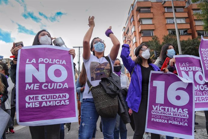 14 May 2021, Colombia, Bogota: Women hold signs during a demonstration against alleged gender abuses committed by the security forces as part of the national strike against the government of Colombian President Ivan Duque Marquez. Photo: Camila Díaz/col