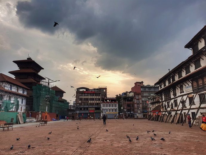 30 April 2021, Nepal, Kathmandu: Few people cross Durbar Square in the early morning. Nepal's Kathmandu valley on Thursday entered a lockdown amid a resurgence in coronavirus cases. Photo: Sunil Sharma/ZUMA Wire/dpa