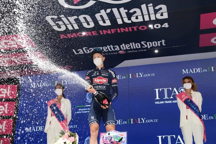 Belgian cyclist Tim Merlier of team Alpecin-Fenix celebrates on the podium after winning the 2nd stage of the 104th edition of the Giro d'Italia cycling race, 179 km from Stupinigi (Nichelino) to Novara.