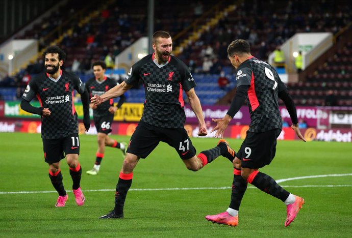 19 May 2021, United Kingdom, Burnley: Liverpool's Nathaniel Phillips (C) celebrates scoring his side's second goal during the English Premier League soccer match between Burnley and Liverpool at Turf Moor. Photo: Alex Livesey/PA Wire/dpa