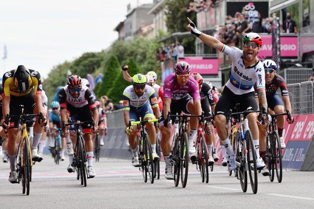 Italian cyclist Giacomo Nizzolo of team Qhubeka Assos crosses the finish line to win the thirteenth stage of the 104th edition of the Giro d'Italia cycling race, 198km between Ravenna and Verona.