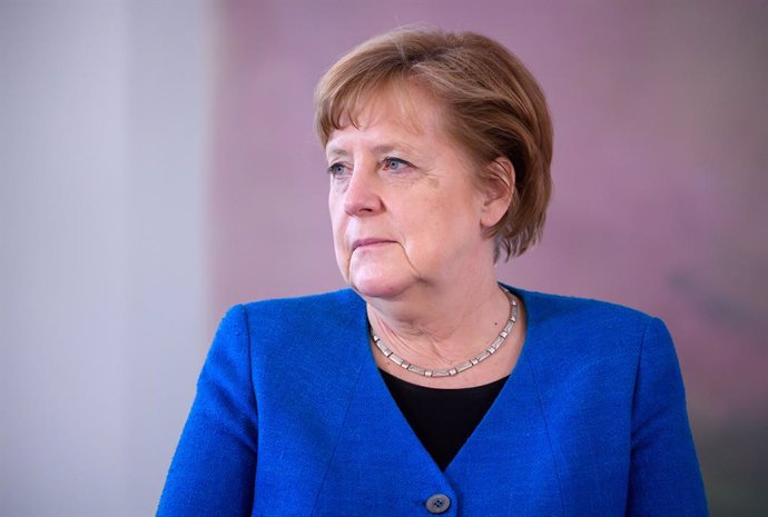 20 May 2021, Berlin: German Chancellor Angela Merkel sits during the presentation of the certificate of dismissal to the previous Minister for Family Affairs Giffey and the certificate of appointment as the new  Minister for Family Affairs to Minister o