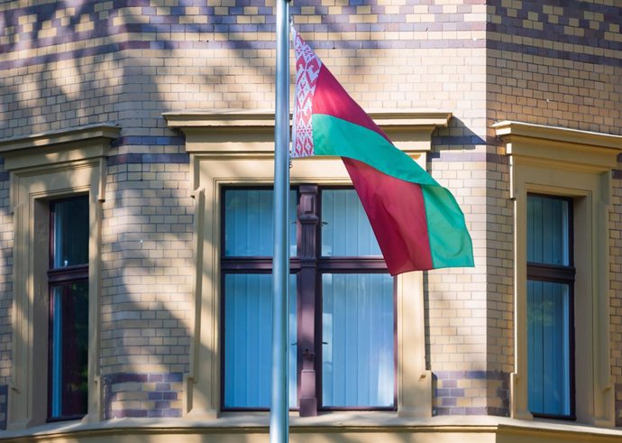 24 May 2021, Berlin: The national flag of Belarus flies in front of the Belarusian embassy in Berlin. The EU has strongly condemned the forced landing of a scheduled flight by Belarusian authorities in Minsk and held out the prospect of sanctions agains