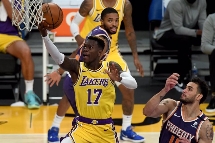 Archivo - 02 March 2021, US, Los Angeles: Los Angeles Lakers player Dennis Schroder (L) in action with Phoenix Suns player Abdel Nader during the US NBA basketball match between Los Angeles Lakers and Phoenix Suns at the Staples Center. Photo: Hans Gutk