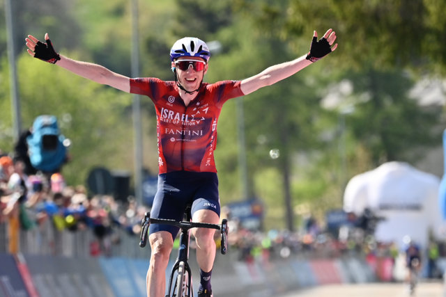 Irish cyclist Daniel Martin of Team Israel Start-Up Nation celebrates as he crosses the finish line to win the 17th stage of the 104th edition of the Giro d'Italia cycling race, 193km from Canazei to Sega di Ala.