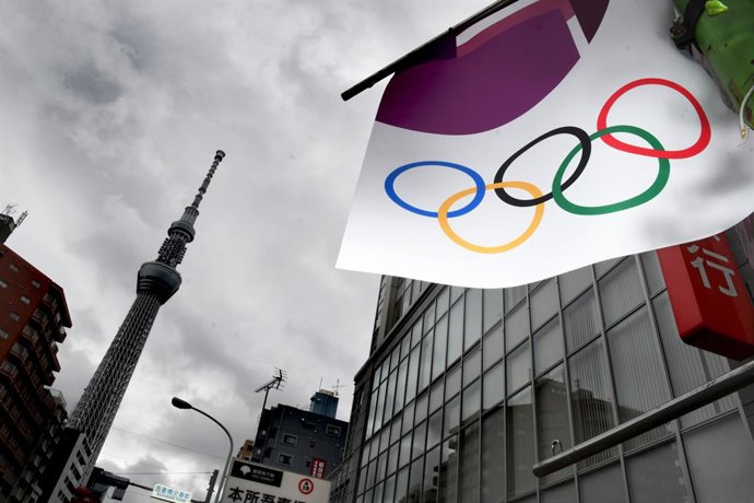 21 May 2021, Japan, Tokyo: A Tokyo 2020 banner can be seen hanging from an electricity pole. Photo: Ramiro Agustin Vargas Tabares/ZUMA Wire/dpa