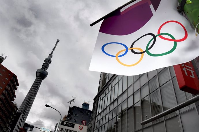 21 May 2021, Japan, Tokyo: A Tokyo 2020 banner can be seen hanging from an electricity pole. Photo: Ramiro Agustin Vargas Tabares/ZUMA Wire/dpa