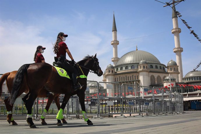 01 May 2021, Turkey, Istanbul: Female police officers on horseback walk at Taksim Square during a Protest to mark the May Day, International Workers' Day. Photo: Hakan Akgun/SOPA Images via ZUMA Wire/dpa