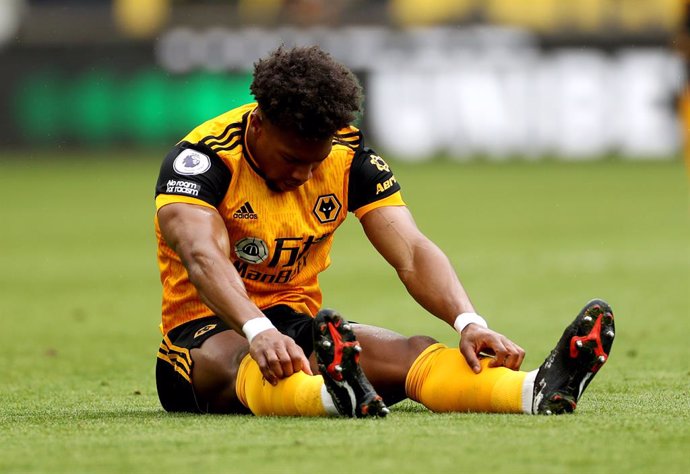 23 May 2021, United Kingdom, Wolverhampton: Wolverhampton Wanderers' Adama Traore sits injured on the pitch during the English Premier League soccer match between Wolverhampton Wanderers and Manchester United at the Molineux Stadium. Photo: Bradley Coll