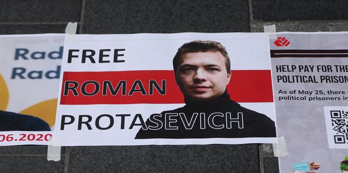 29 May 2021, Ireland, Dublin: A sign with a portrait of the arrested Belarusian journalist Protasevich and the words "Free Roman Protasevich" is pasted on the ground outside the General Post Office during a protest by members of the Belarusian community