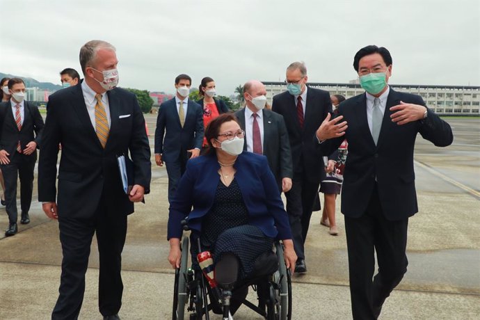 HANDOUT - 06 June 2021, Taiwan, Taipei: Taiwan Foreign Minister Joseph Wu (R) receives US Senators Dan Sullivan (L), Tammy Duckworth(C), Chris Coons, after arriving at Taipei Songshan Airport to visit the island on bilateral relations and regional secur