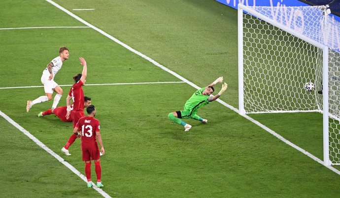 11 June 2021, Italy, Rome: Italy's Ciro Immobile (L) scores his side's seond goal past Turkey goalkeeper Ugurcan Cakir during the UEFA EURO 2020 Group Asoccer match between Italy and Turkey at the Olympic Stadium. Photo: Matthias Balk/dpa