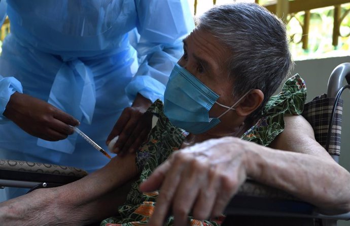 13 June 2021, Malaysia, George Town: An elderly man receives a dose of a COVID-19 vaccine from the Mobile Vaccination Unit. Photo: K.Ganeson/BERNAMA/dpa