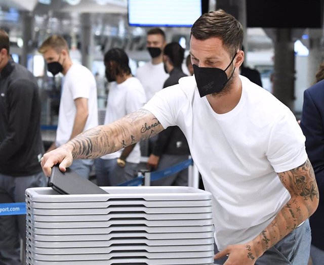 Austria's Marko Arnautovic collects his items at Innsbruck airport before the departure of the Austrian football team to Amsterdam ahead of Thursday's UEFA EURO 2020 Group C soccer match against Netherlands. Photo: Robert Jaeger/APA/dpa