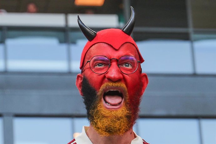 17 June 2021, Denmark, Copenhagen: A Belgium fan cheers in the stands before the start of the UEFA EURO 2020 Group B soccer match between Denmark and Belgium at Parken stadium. Photo: Bruno Fahy/BELGA/dpa