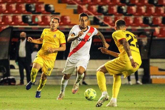 Oscar Trejo of Rayo Vallecano and Santiago Bueno of Girona FC in action during the Liga SmartBank playoff football match played between Rayo Vallecano and Girona FC at Estadio de Vallecas on Jun 13, 2021 in Madrid, Spain.