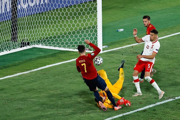 Alvaro Morata of Spain and Wojciech Szczesny of Poland in action during the UEFA EURO 2020 Group E football match between Spain and Poland at La Cartuja stadium on June 19, 2021 in Seville, Spain.