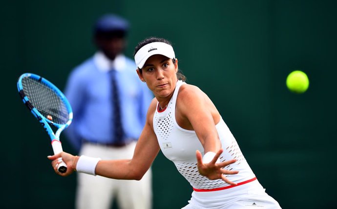 Archivo - 02 July 2019, England, London: Spanish tennis player Garbine Muguruza in action against Brazil's Pauline Parmentier during their women's singles round of 128 match on day two of the 2019 Wimbledon Grand Slam tennis tournament at the All Englan