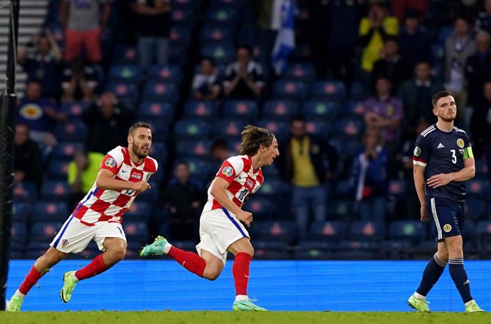 22 June 2021, United Kingdom, Glasgow: Croatia's Luka Modric (C) celebrates scoring his side's second goal during the UEFA EURO 2020 Group D soccer match between Croatia and Scotland at Hampden Park. Photo: Andrew Milligan/PA Wire/dpa