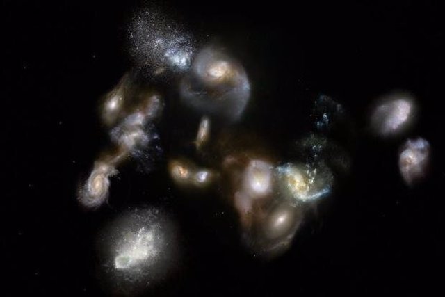 Impresión de un artista del protoglúmulo de galaxias SPT2349-56, un grupo de más de una docena de galaxias que interactúan en el universo temprano.