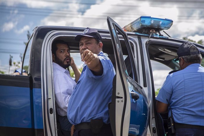 FILED - 22 June 2021, Nicaragua, Managua: Nicaraguan presidential candidate Felix Madariaga (L) is arrested by police as he tried to leave the capital. Five candidates for the presidential candidacy from opposition alliances were arrested within a few w