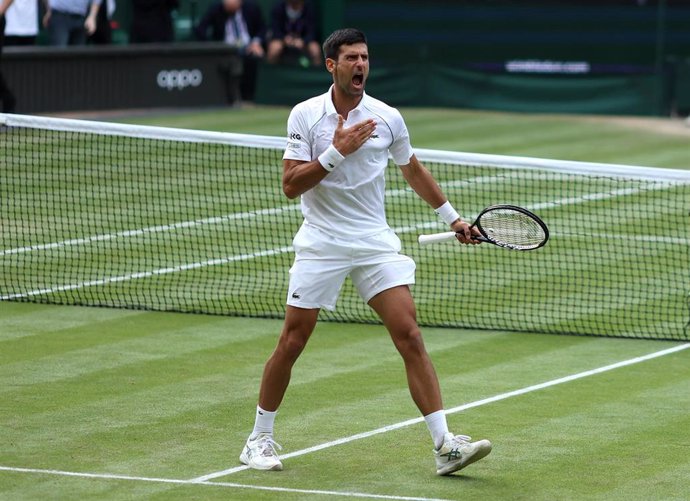 09 July 2021, United Kingdom, London: Serbian tennis player Novak Djokovic celebrates defeating Canadian Denis Shapovalov during their men's singles semi final match on day eleven of the 2021 Wimbledon Tennis Championships at The All England Lawn Tennis
