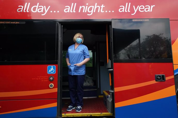 02 July 2021, United Kingdom, Crieff: Vaccination Nurse Lesley Cousland waits for a patient onboard a bus in the car park of Crieff Community Hospital. The bus is being used by the Scottish Ambulance Service as a mobile vaccination centre where the vacc
