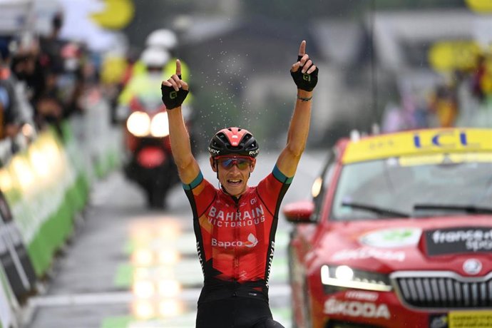 Belgian cyclist Dylan Teuns of Bahrain Victorious celebrates while crossing the finish line to win the eighth stage of the 108th edition of the Tour de France cycling race, 150.8 km from Oyonnax to Le Grand-Bornand.