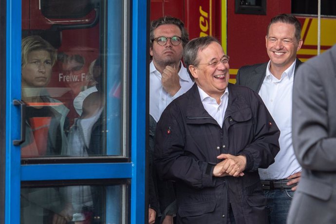 17 July 2021, North Rhine-Westphalia, Erftstadt: Armin Laschet, Minister President of North Rhine-Westphalia and candidate for chancellor, laughs while German President Frank-Walter Steinmeier give a press after visitng the fire brigade control centre i