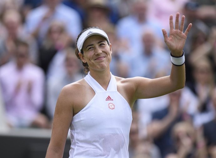 28 June 2021, United Kingdom, London: Spanish tennis player Garbine Muguruza celebrates victory after defeating France's Fiona Ferro in their women's singles first round match on day one of the 2021 Wimbledon Tennis Championships at The All England Lawn