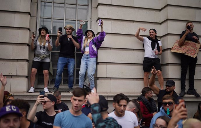 27 June 2021, United Kingdom, London: People gather in Whitehall Street during a #FreedomToDance march organised by Save Our Scene, in protest of the government's perceived disregard for the live music industry throughout the coronavirus pandemic. Photo