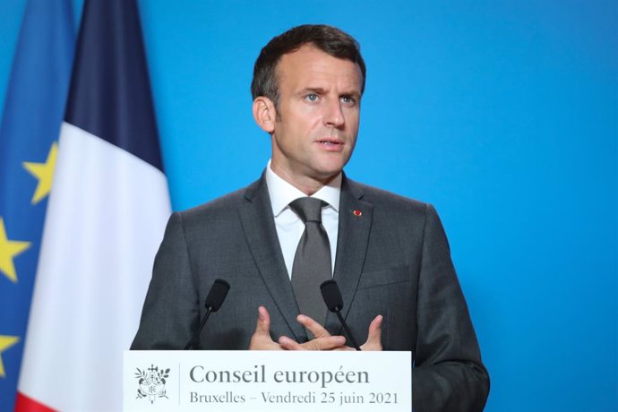 HANDOUT - 25 June 2021, Belgium, Brussels: French President Emmanuel Macron speaks during a press conference after a two-days European Union summit at the European Council. Photo: Mario Salerno/European Council/dpa - ATTENTION: editorial use only and on