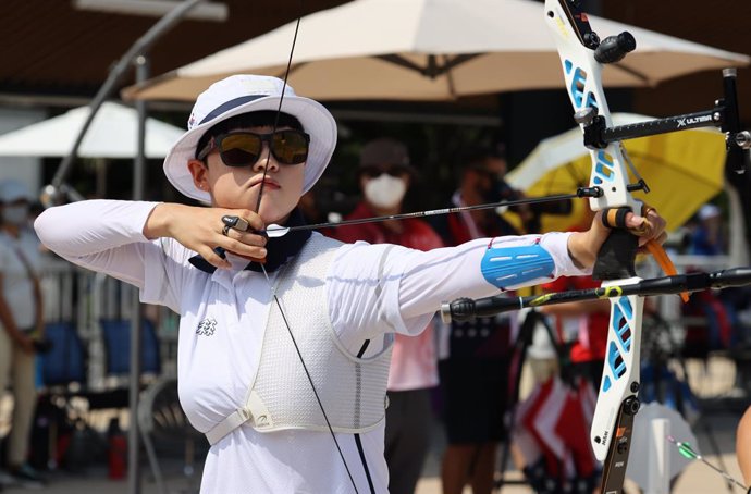 23 July 2021, Japan, Tokyo: South Korean archer An San aims for the target during the women's archery individual ranking round at Yumenoshima Park Archery Field during the Tokyo 2020 Olympic Games. Photo: -/YNA/dpa
