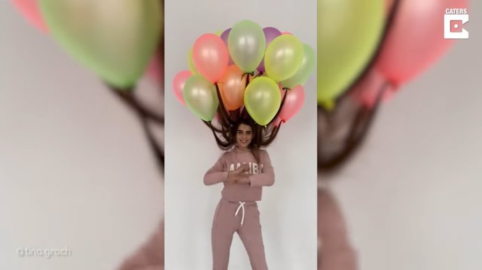 Esta ucraniana de 23 años se roba todas las miradas con su extravagante peinado hecho con una docena de globos de helio