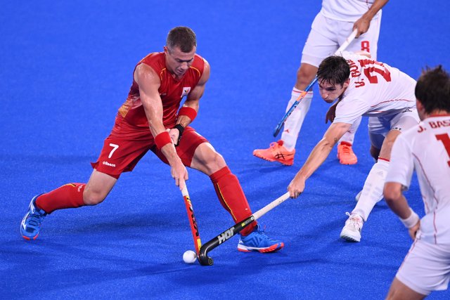 Belgium's John-John Dohmen and Spain's Vicenc Ruiz Torruella battle for the ball during the Men's Quarter-final filed hockey match between Belgium and Spain at the Oi Hockey Stadium North Pitch, in the course of the Tokyo 2020 Olympic Games.