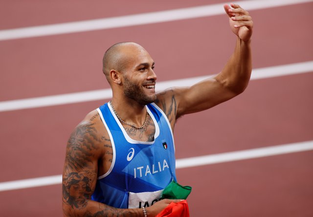 01 August 2021, Japan, Tokyo: Italy's Marcell Lamont Jacobs celebrates winning the Men's 100m Final race of the athletics competition at the Olympic Stadium during the Tokyo 2020 Olympic Games. Photo: Oliver Weiken/dpa