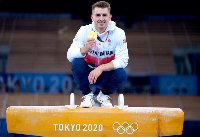 01 August 2021, Japan, Tokyo: Great Britain's gold medallist Max Whitlock celebrates on the Pommel Horse after the medal ceremony of the Men's Pommel Horse Final of the Artistic Gymnastics competition at the Ariake Gymnastics Centre during the Tokyo 202