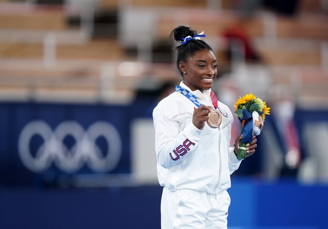 USA's Simone Biles celebrates bronze medal at the award ceremony for the Women's Balance Beam Final of the Artistic Gymnastics competition at the Ariake Gymnastics Centre during the Tokyo 2020 Olympic Games