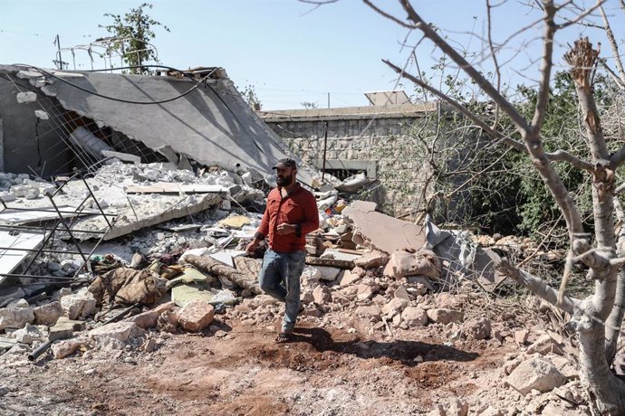 22 July 2021, Syria, Iblin: A man inspects a destroyed house after it was targeted by a missile shelling carried out by the Syrian government at the village of Iblin in Idlib. At least seven civilians, all from the same family, were killed on Thursday a