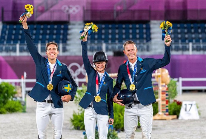 Team Sweden on the podium. (L to R): Henrik von Eckermann, Malin Baryard-Johnsson and Peder Fredricson. Almost a century since Sweden last won Olympic Jumping Team gold and tonight they did it with both style and grace at the Tokyo 2020 Olympic Games in