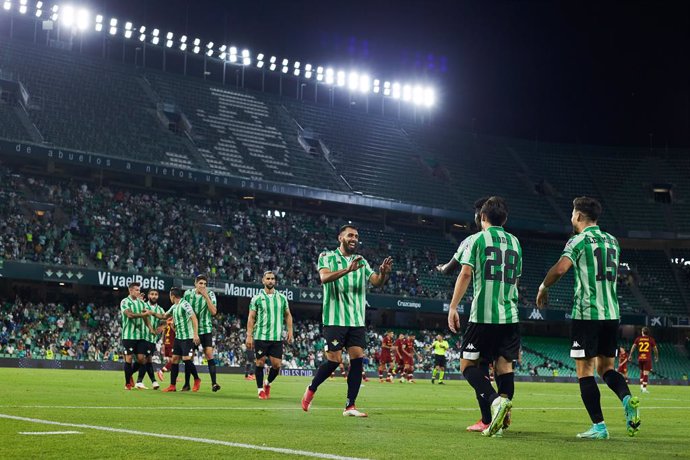 Alex Moreno of Real Betis celebrates a goal with teammates during the friendly football match played between Real Betis Balompie and AS Rome at Benito Villamarin stadium on august 07, 2021, in Sevilla, Spain.