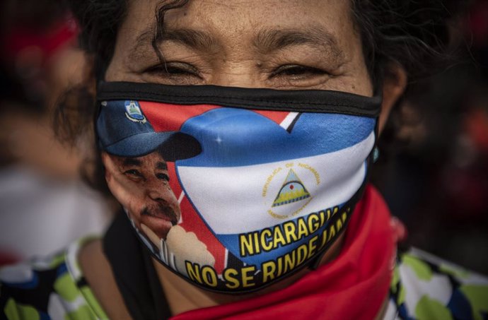 18 July 2021, Nicaragua, Managua: Asupporter of the Nicaraguan Sandinista National Liberation Front takes part in a march to celebrate the 42nd anniversary of the triumph of the Sandinista Revolution and in support of the ongoing anti-government protes