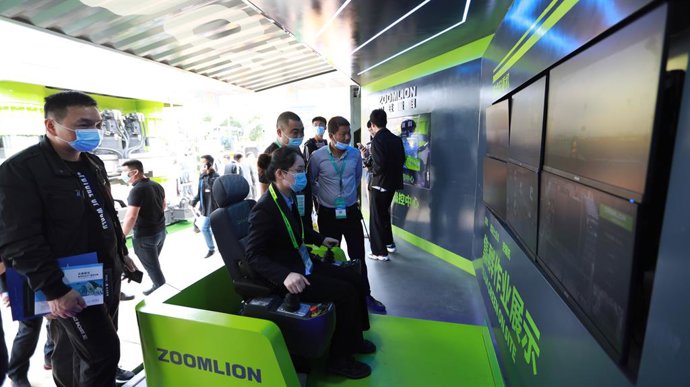 A Zoomlion employee demonstrates its 5G Tower Crane Remote Intelligent Control System at the 2021 Changsha International Construction Equipment Exhibition (CICEE)