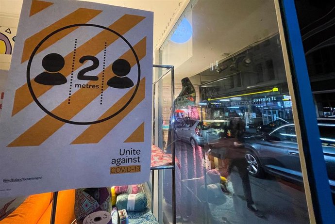 Cartel de aviso contra la COVID-19 en Wellington, Nueva Zelanda