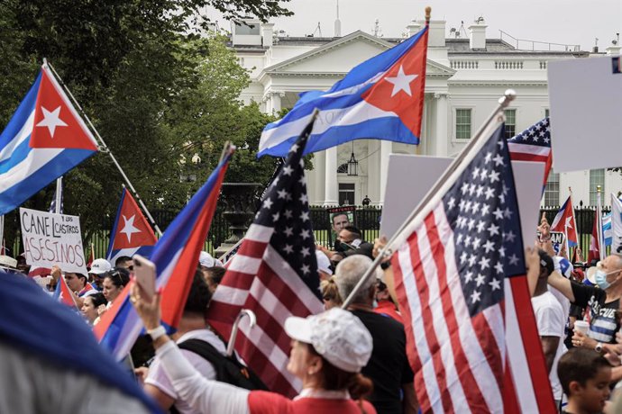 26 July 2021, US, Washington: Cubans gather at Lafayette Park in front of the White House to demand USPresident Joe Biden provide humanitarian help to their country and to intervene in Cuba during a rally against the Cuban government. Photo: Lenin Noll