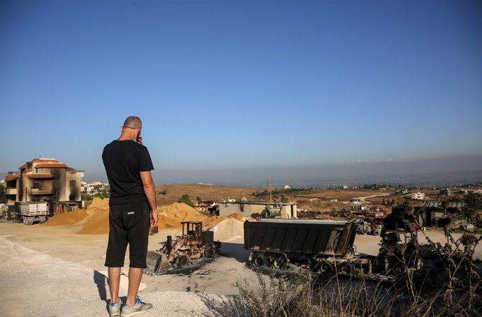16 August 2021, Lebanon, Talil: A man looks at the site where fuel tanks exploded in Lebanese northern village of Talil that killed more than 20 people and burned more than 80 others. Photo: Marwan Naamani/dpa