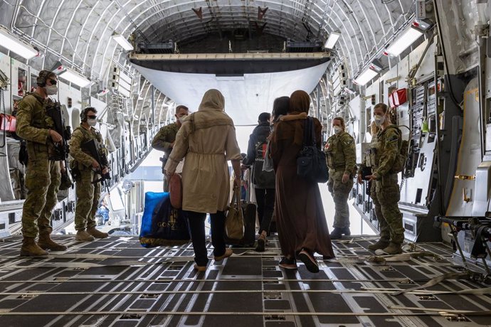 A supplied image obtained on Sunday, August 22, 2021, of Afghanistan evacuees arrive at Australias main operating base in the Middle East, on board a Royal Australian Air Force C-17A Globemaster. Further flights into Kabul are being carefully planned a